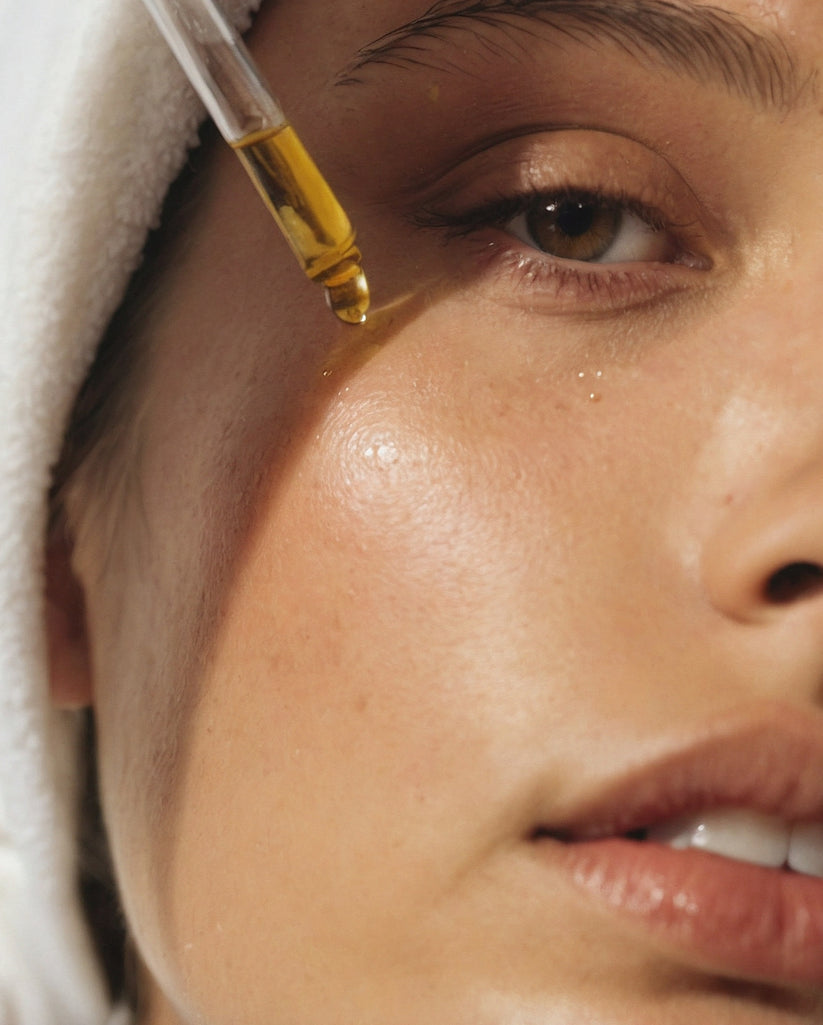 Woman applying best face oil for dehydrated skin with organic botanical ingredients